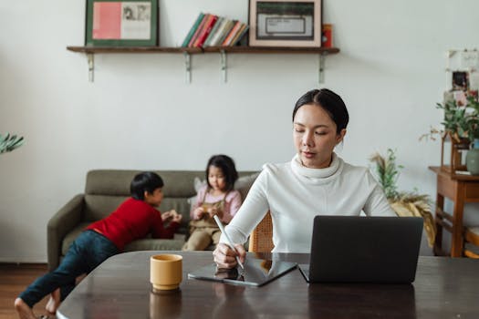 Mother using a tablet to connect with a parenting group