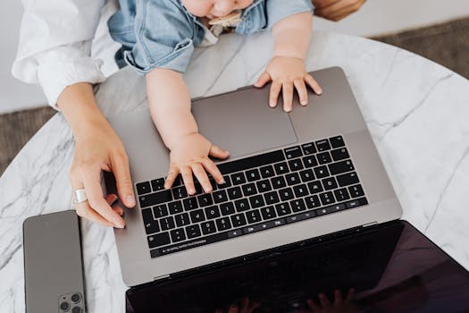 image of a busy working mom at her home office