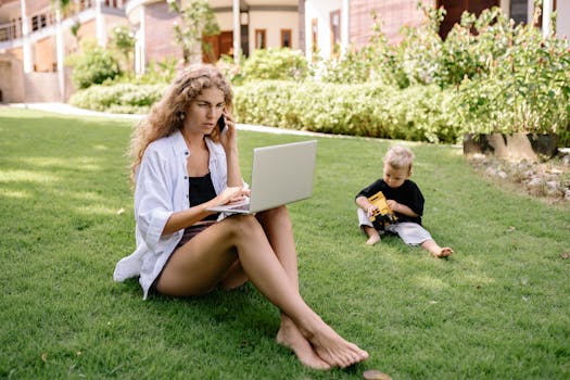 Mom working from home with her child playing nearby