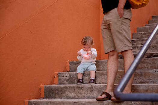 happy toddler taking first steps