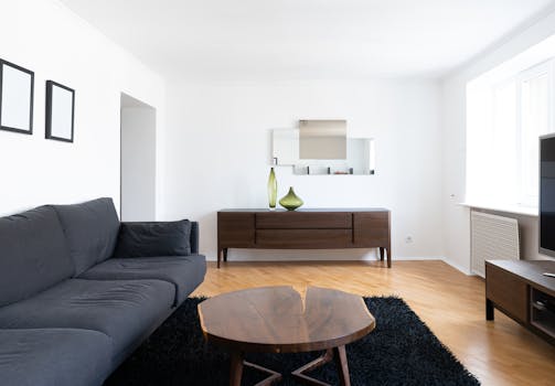 a serene living room with a soft green palette