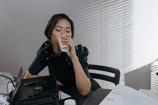 A busy mom taking a break at her desk