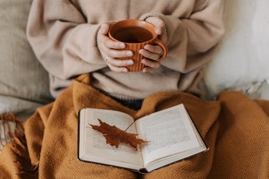 A cozy relaxation corner with a book and a cup of tea